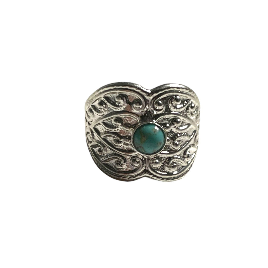 Decorative heart-shaped object with a turquoise gemstone on a white background
