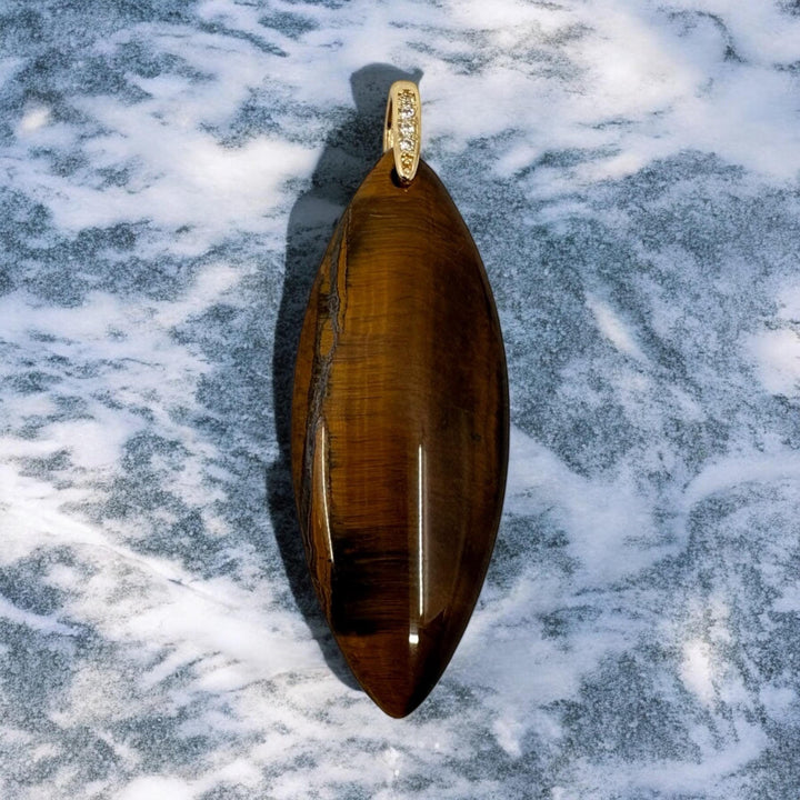 Tiger's Eye Pendant: Polished Stone with Gold Bail